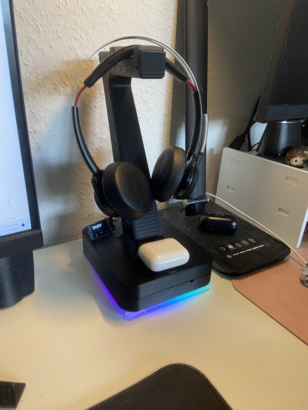 The prototype from the front, AirPods charging on its base